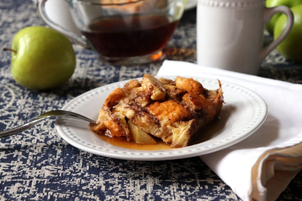 This one pan, Baked Apple French Toast wonder, combines the holiday taste favorites of cinnamon, apple, brown sugar all soaked in custard bread cubes baked to perfection.   Serve this with some warm pure maple syrup and listen for the sounds of falling in love with it!  This is also an amazing recipe to make for the holiday's.  It can be made a day ahead of Christmas so you can pop it in the oven while you are opening gifts!   