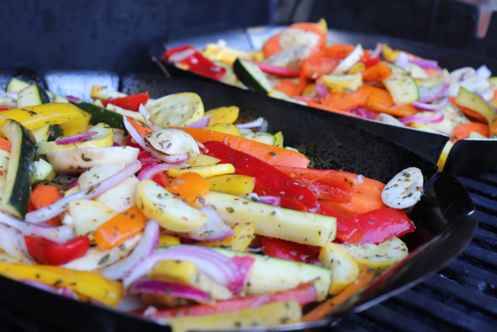 Marinated vegetables on the grill in grilling pans 
