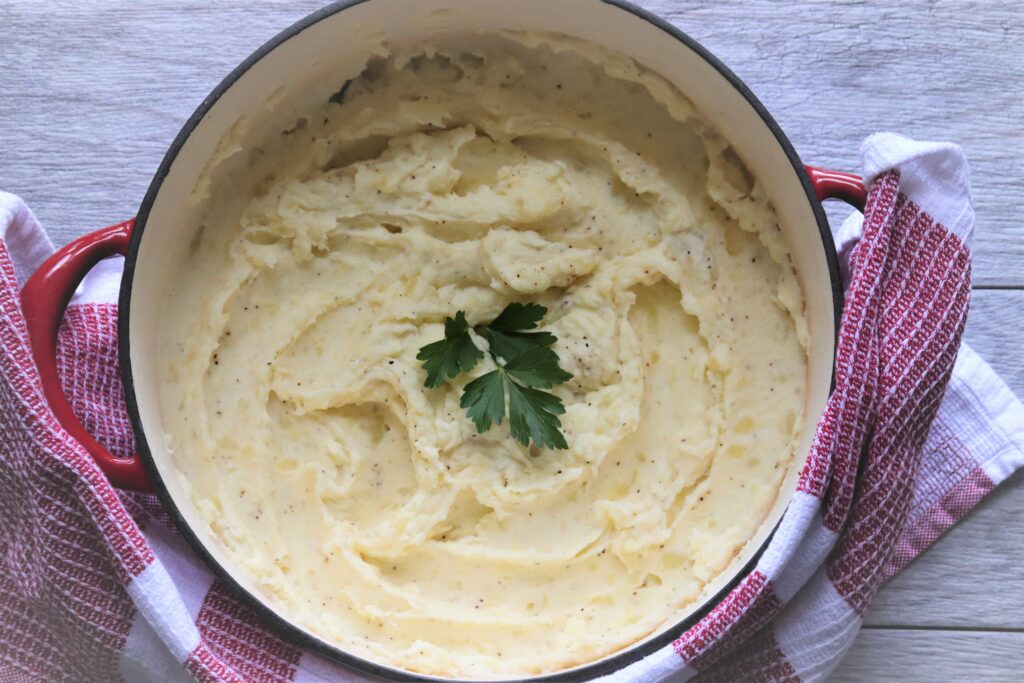 Pan of our best creamy mashed potatoes in Cast Iron Pot