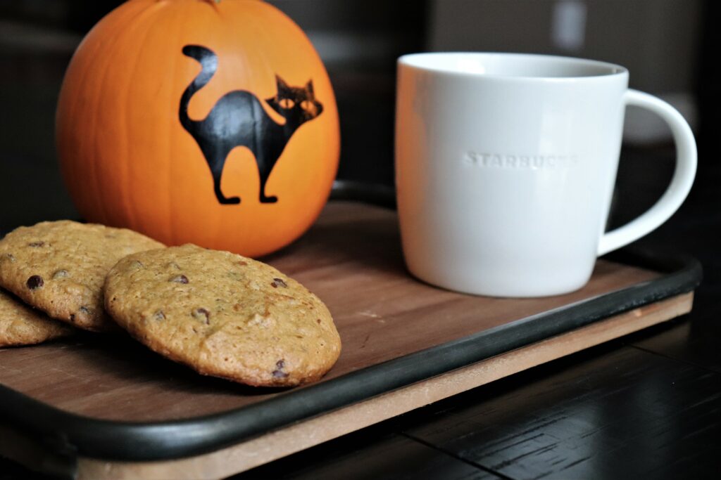 Old fashioned Pumpkin Chocolate Chip Cookies Served With Coffee And Halloween Theme Pumpkin