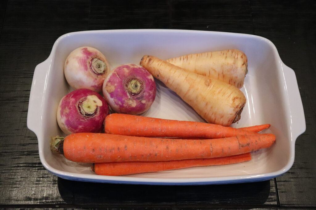 This Roasted Root Vegetable medley recipe  ingredients right from the farmers market.  Turnips, parsnips and carrots ready to roast!